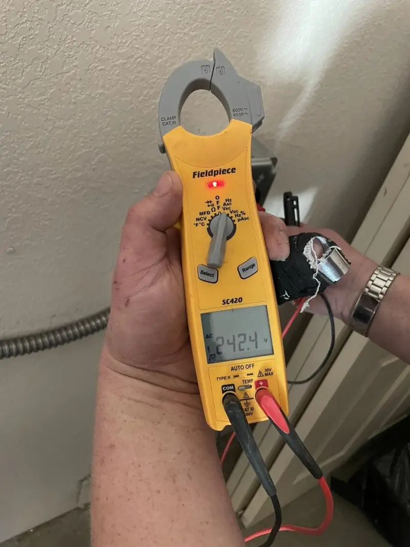 Voltage testing with clamp meter during Generator Installation in Avondale